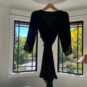 Zara | Black lace silky wrap dress with a deep V neckline and long sleeves